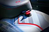 close up photo of red performance seat screw on a bike